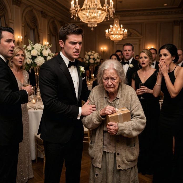 “Get her out of here,” Evan hissed, his voice sharp enough to silence an entire ballroom. The old woman froze, clutching a small gift box to her chest as guests stared in disgust. “I only came to give you this, son,” she whispered. But what happened minutes later turned his perfect wedding into a living nightmare. And by the time Evan discovered the truth, the one person he had rejected had already made a sacrifice so shocking it would haunt him forever.